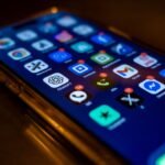 Smartphone screen showing multiple app notifications, representing how to automate social media listening with AI